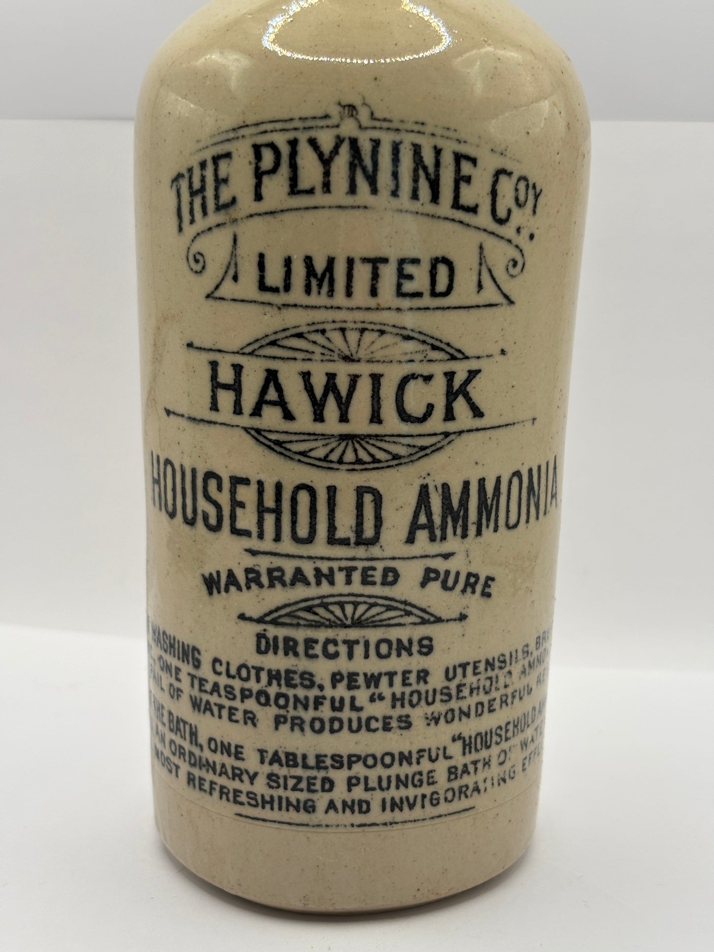 Old advertising stoneware bottle, Plynine household ammonia. Small size 21.5cms