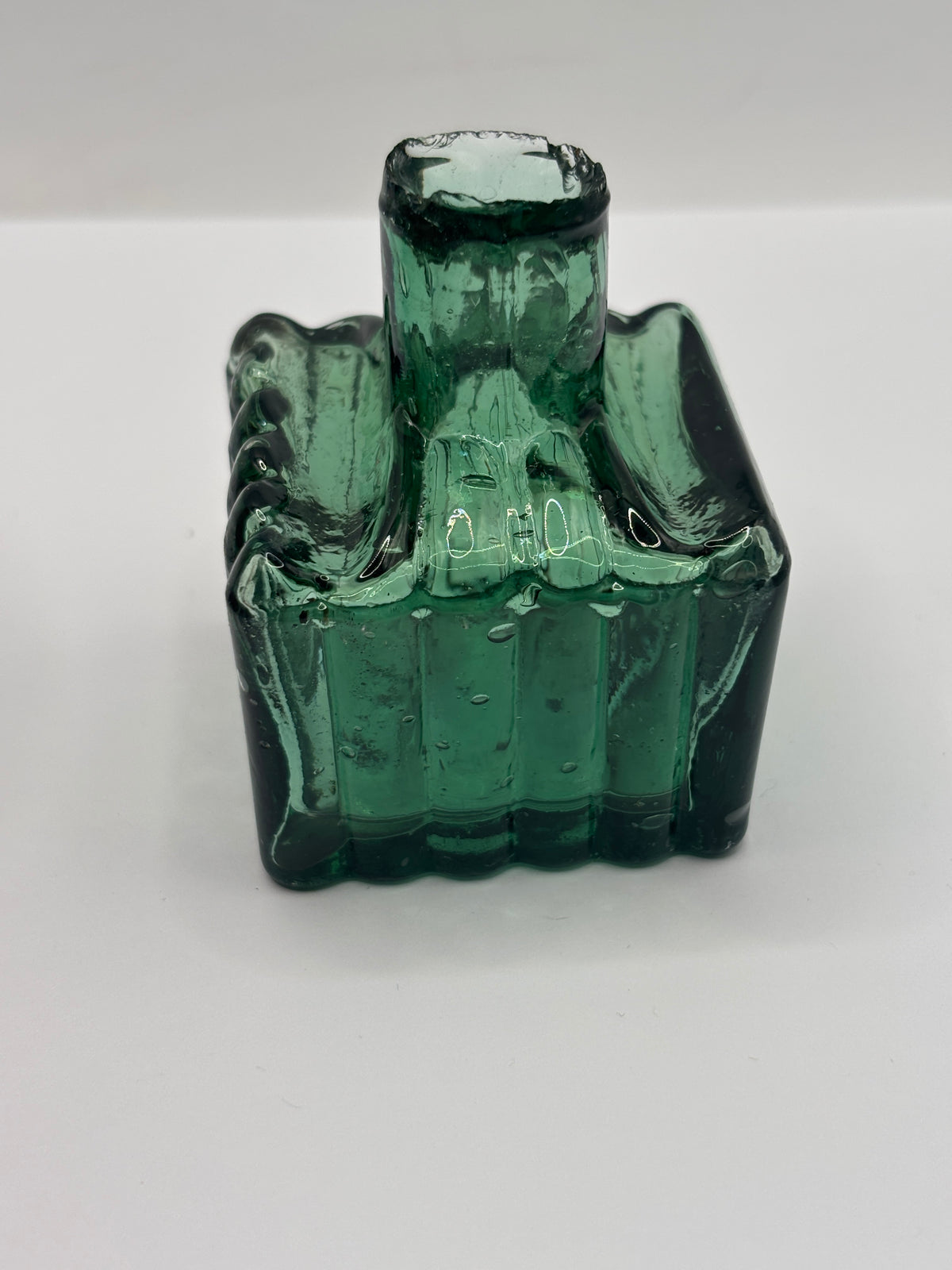 Old dark green glass inkwell, ink bottle, penny ink