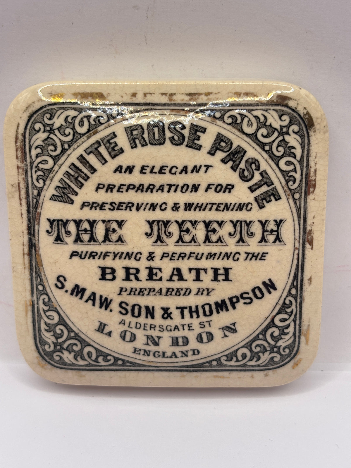 Old advertising lid. White rose paste