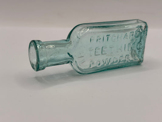 Old aqua glass advertising bottle. Try Pritchards teething powders