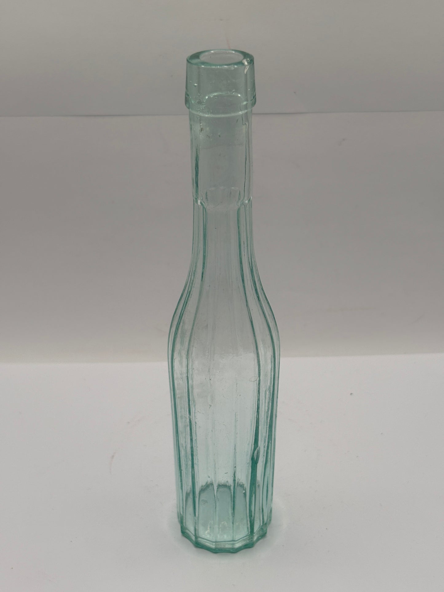 Old aqua glass bottle, vinegar?