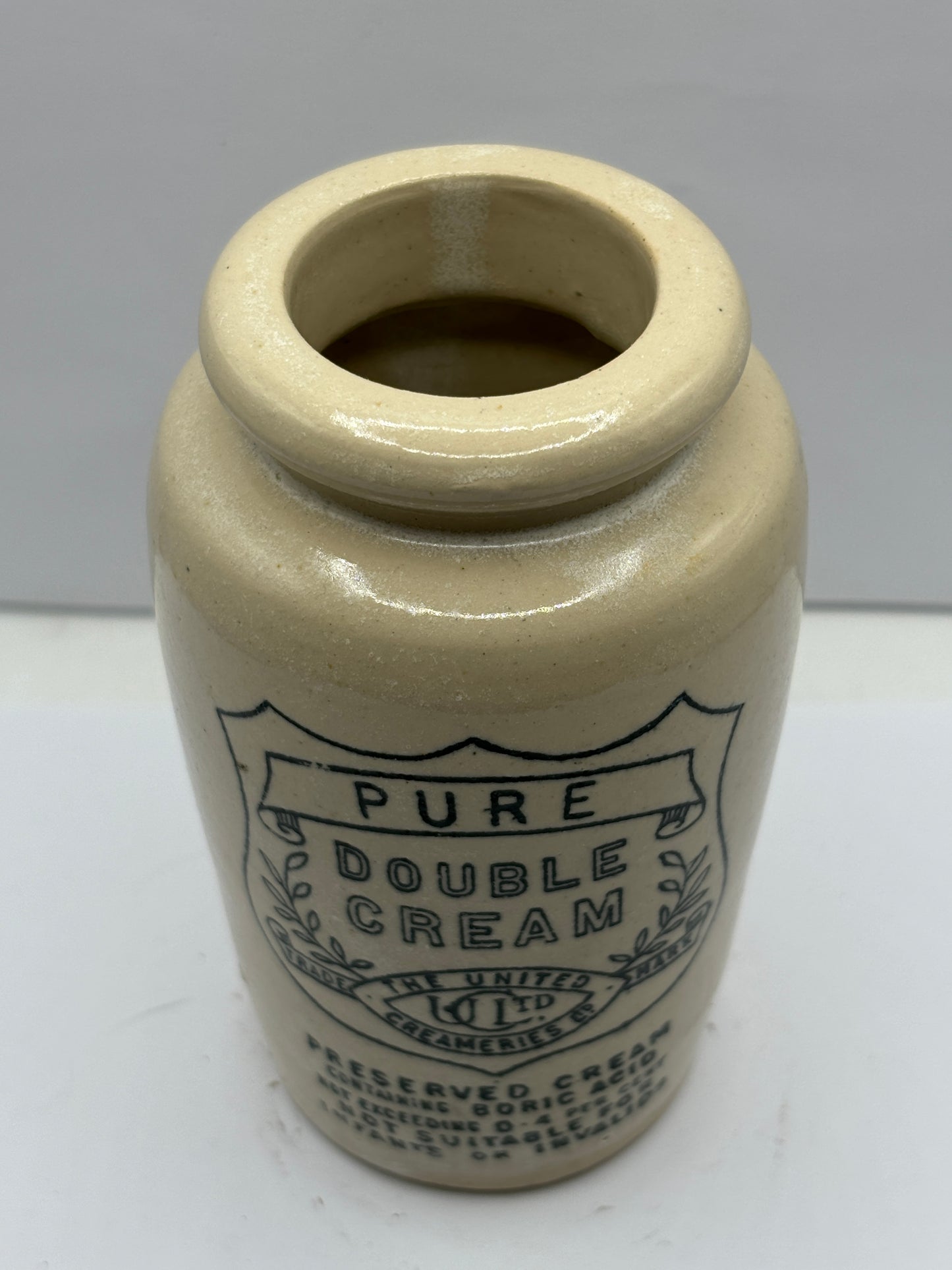 Pure double cream advertising cream pot. The united creameries