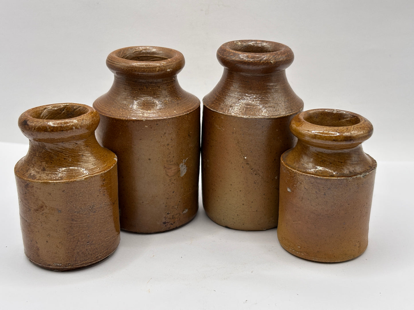 4 old small brown stoneware jars