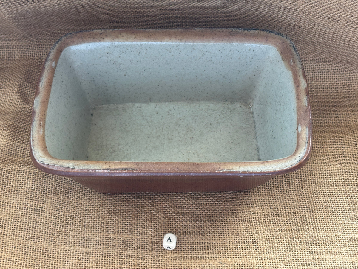 Old brown salt glaze stoneware pie dish (a)