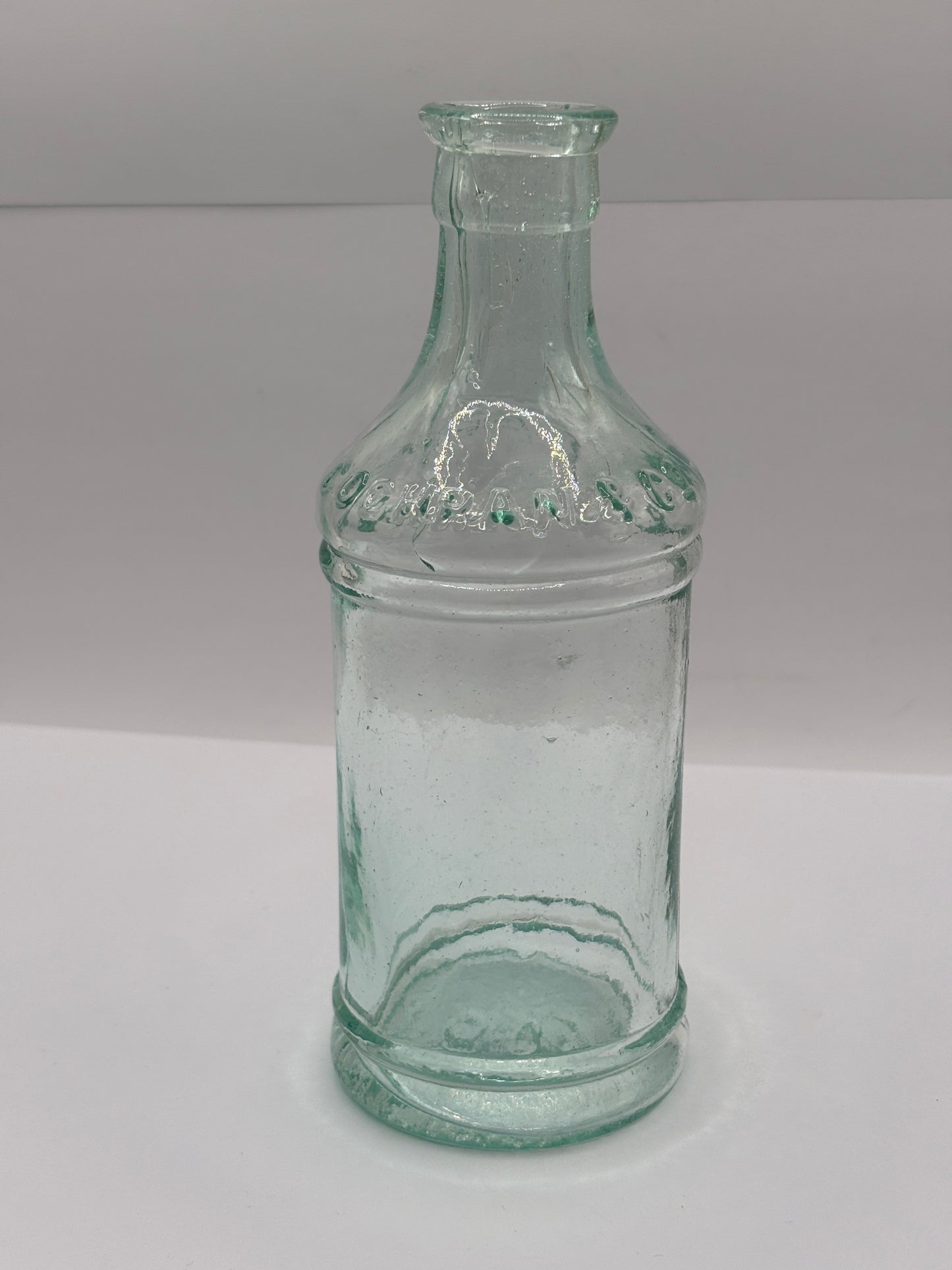 Old tall aqua glass pouring ink. Cochrans liverpool, ink bottle