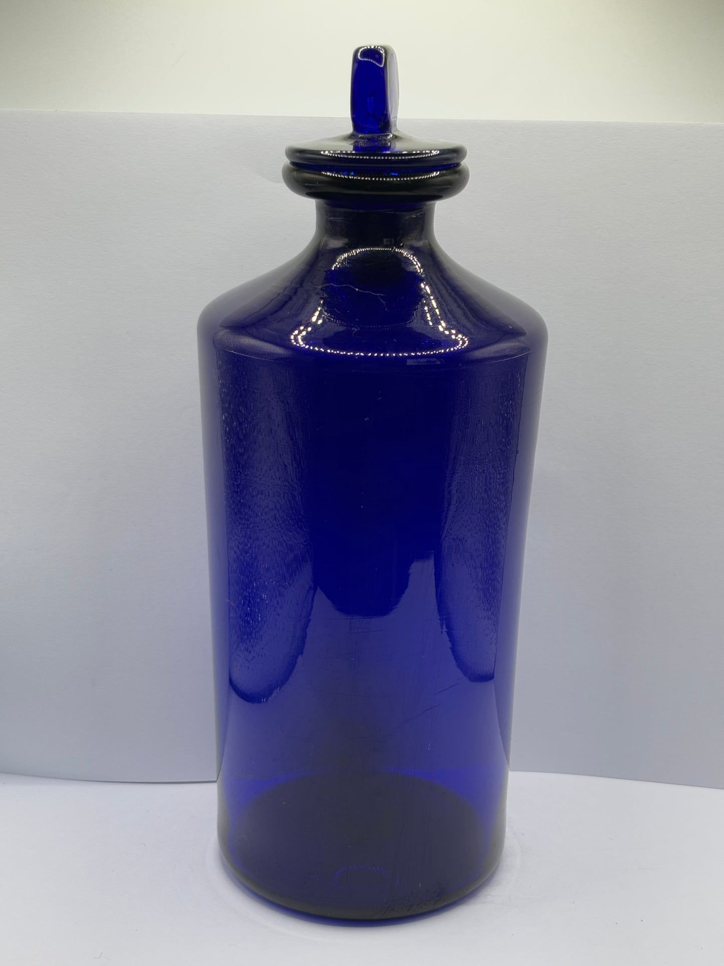 Old pontilled blue glass chemist jar, chemist round. Pharmacy