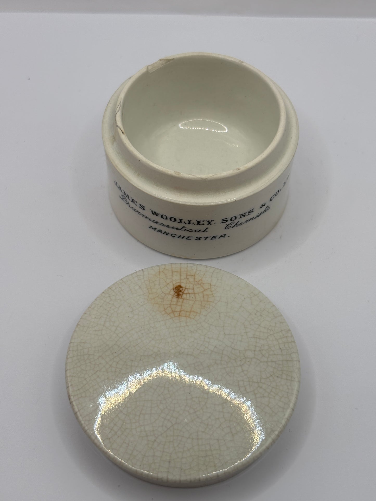 Old advertising chemist lid and base. James Woolley pharmaceutical chemist