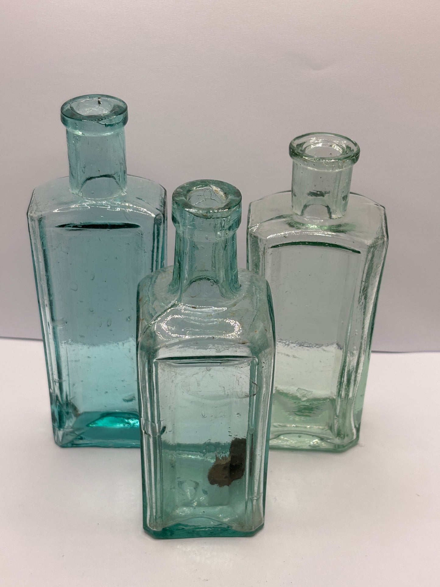 3 old aqua glass chemist bottles
