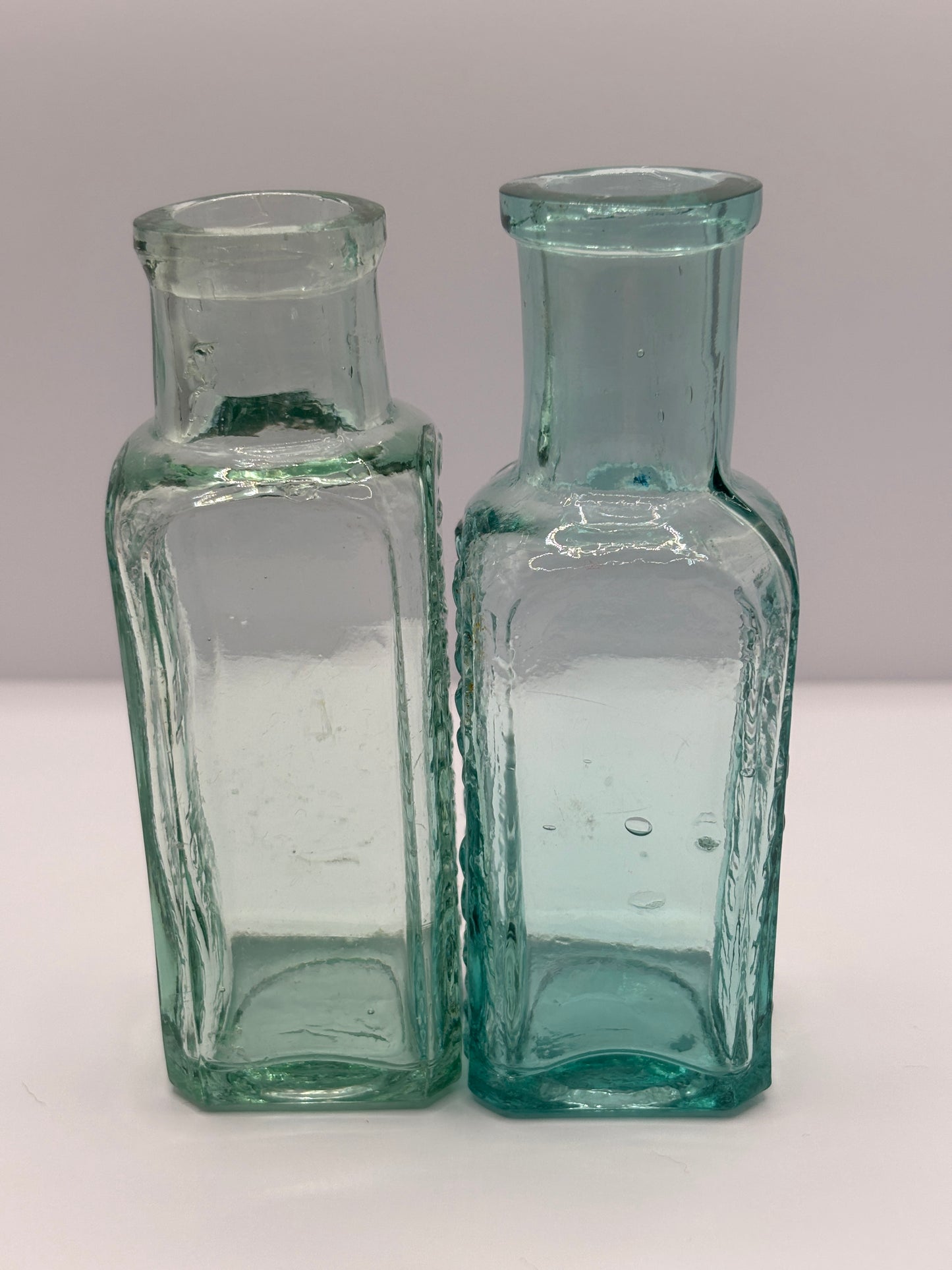 2 old aqua glass Eiffel tower fruit juices bottles