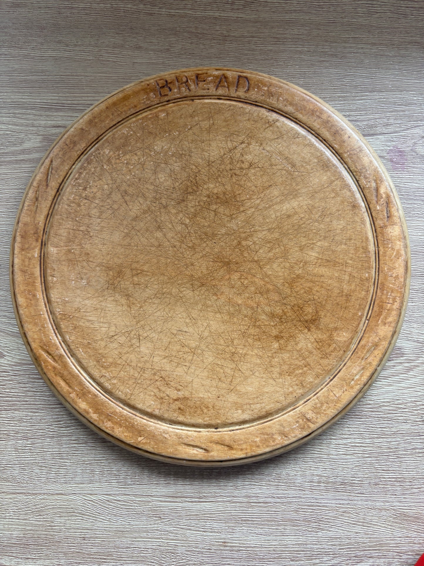 Old wooden carved bread board