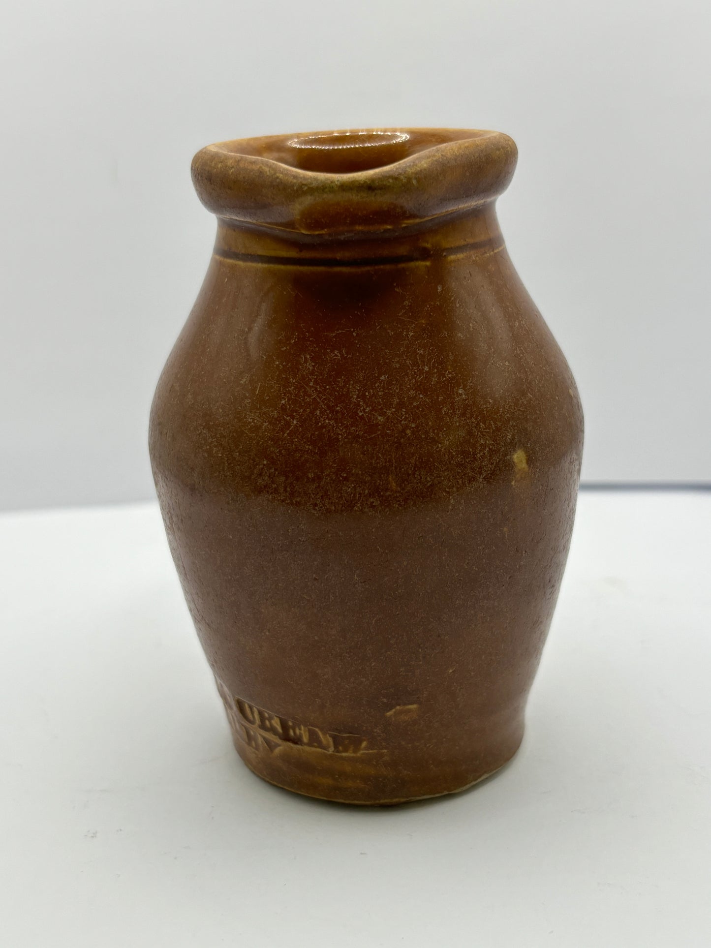 Old stoneware shop display cream pot. Turners cream Disley.