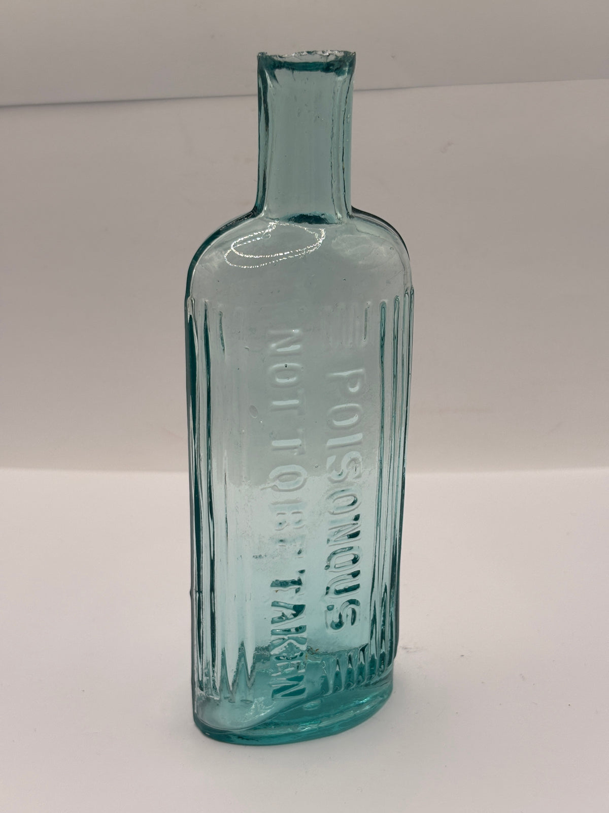 Old aqua glass poison bottle, POISONOUS Not to be taken