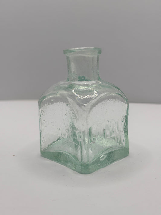 Old aqua glass advertising inkwell, ink bottle. Pridge