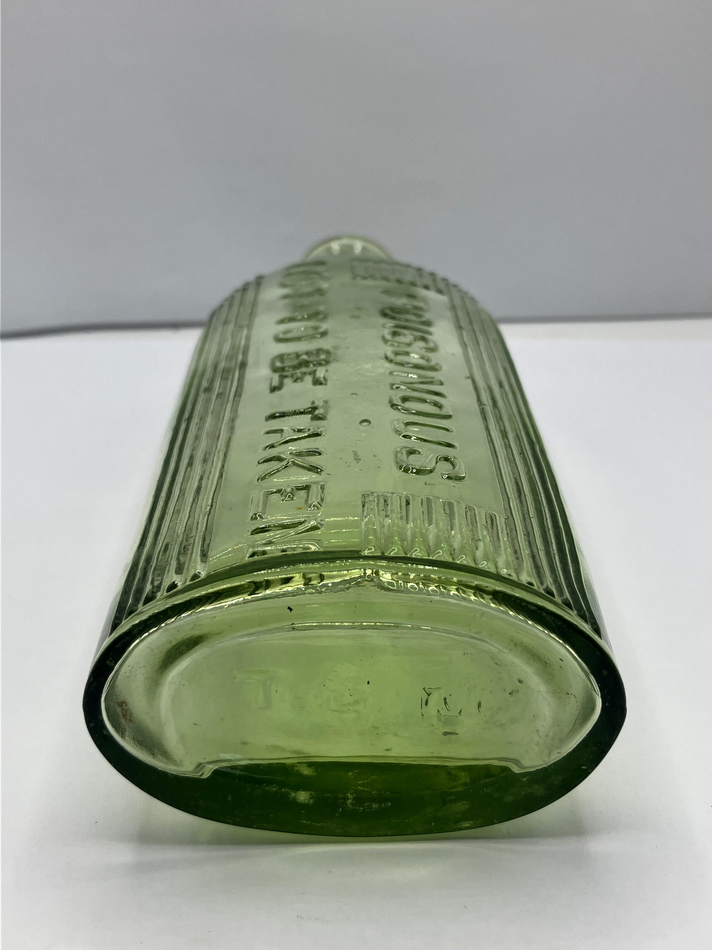 Green glass poison bottle, poisonous not to be taken