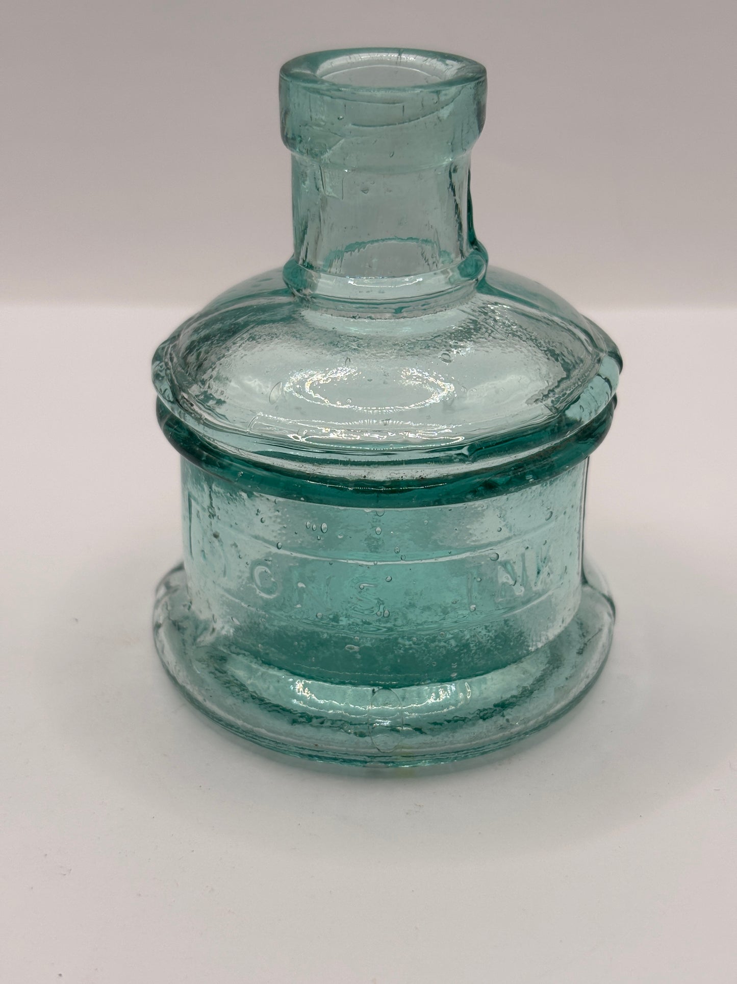 Old aqua glass advertising inkwell, ink bottle. Lyons ink