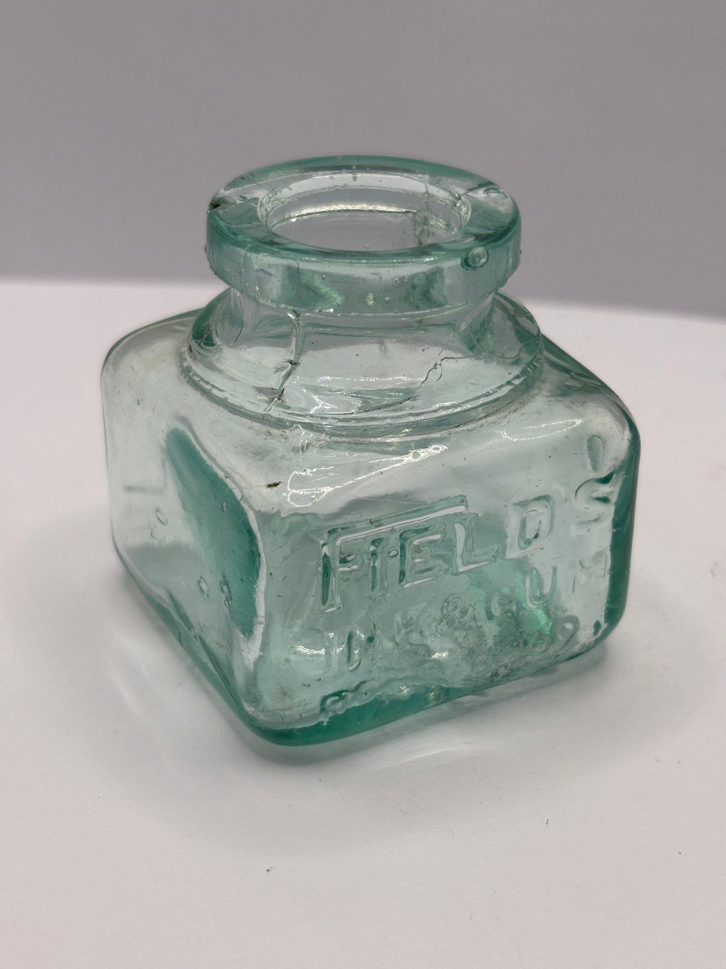 Old aqua glass ink bottle, inkwell. fields ink & gum