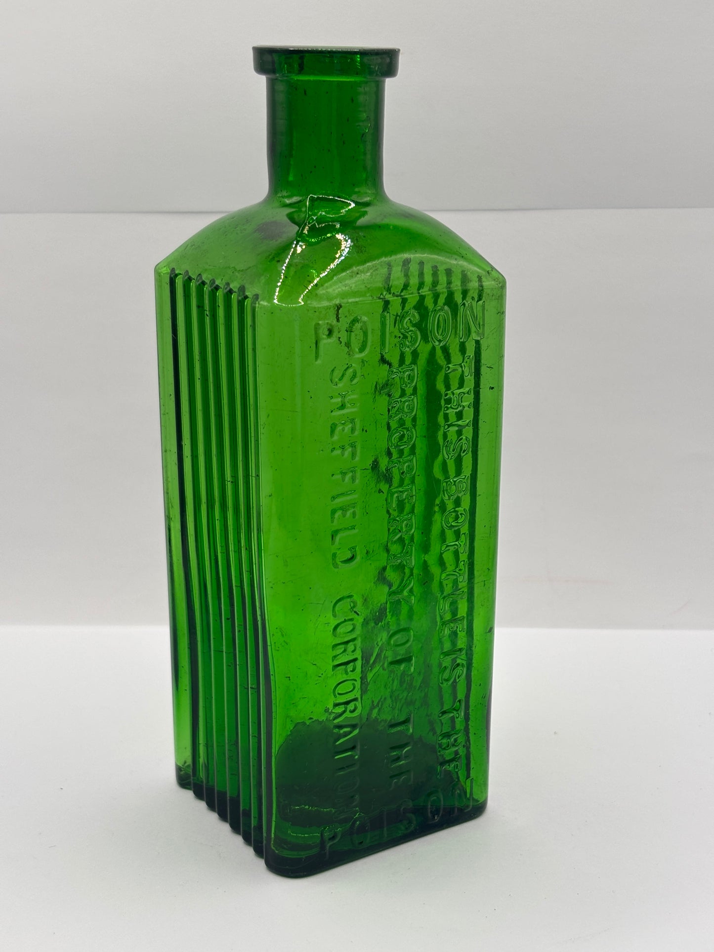 Old green glass poison bottle, Sheffield corporation poison bottle. Chipped