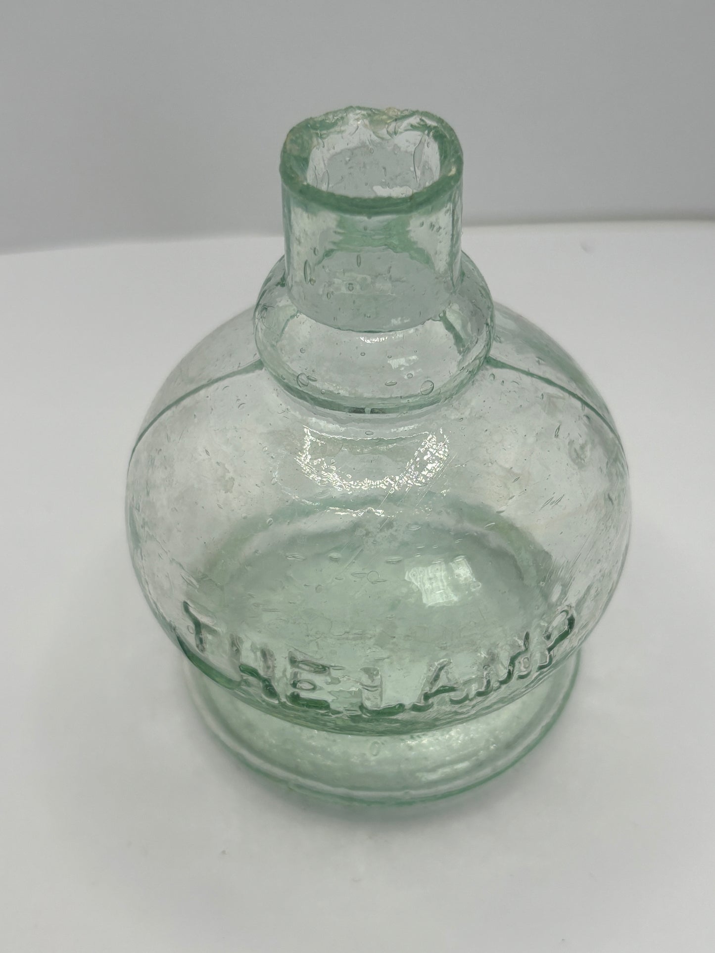 Small aqua glass oil lamp. The Lamp