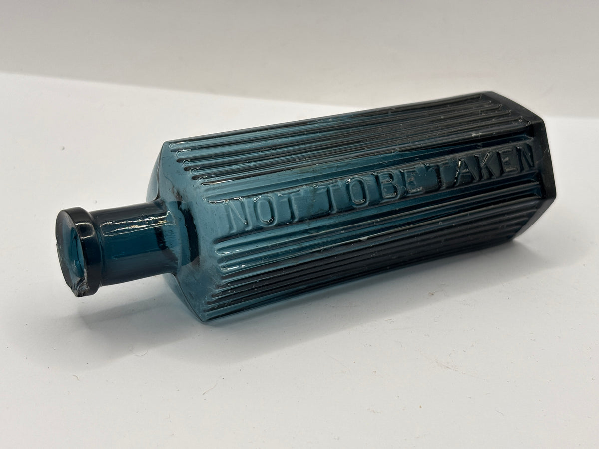 old blue glass ribbed poison bottle, not to be taken. Unusual colour