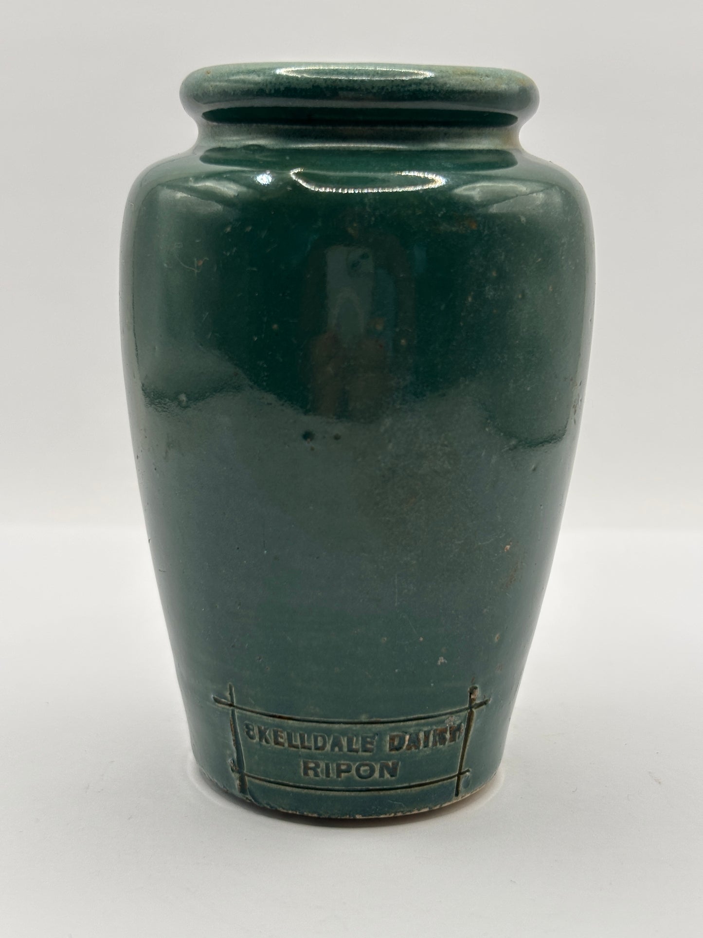 Old green advertising cream pot, Skelldale dairy. Ripon