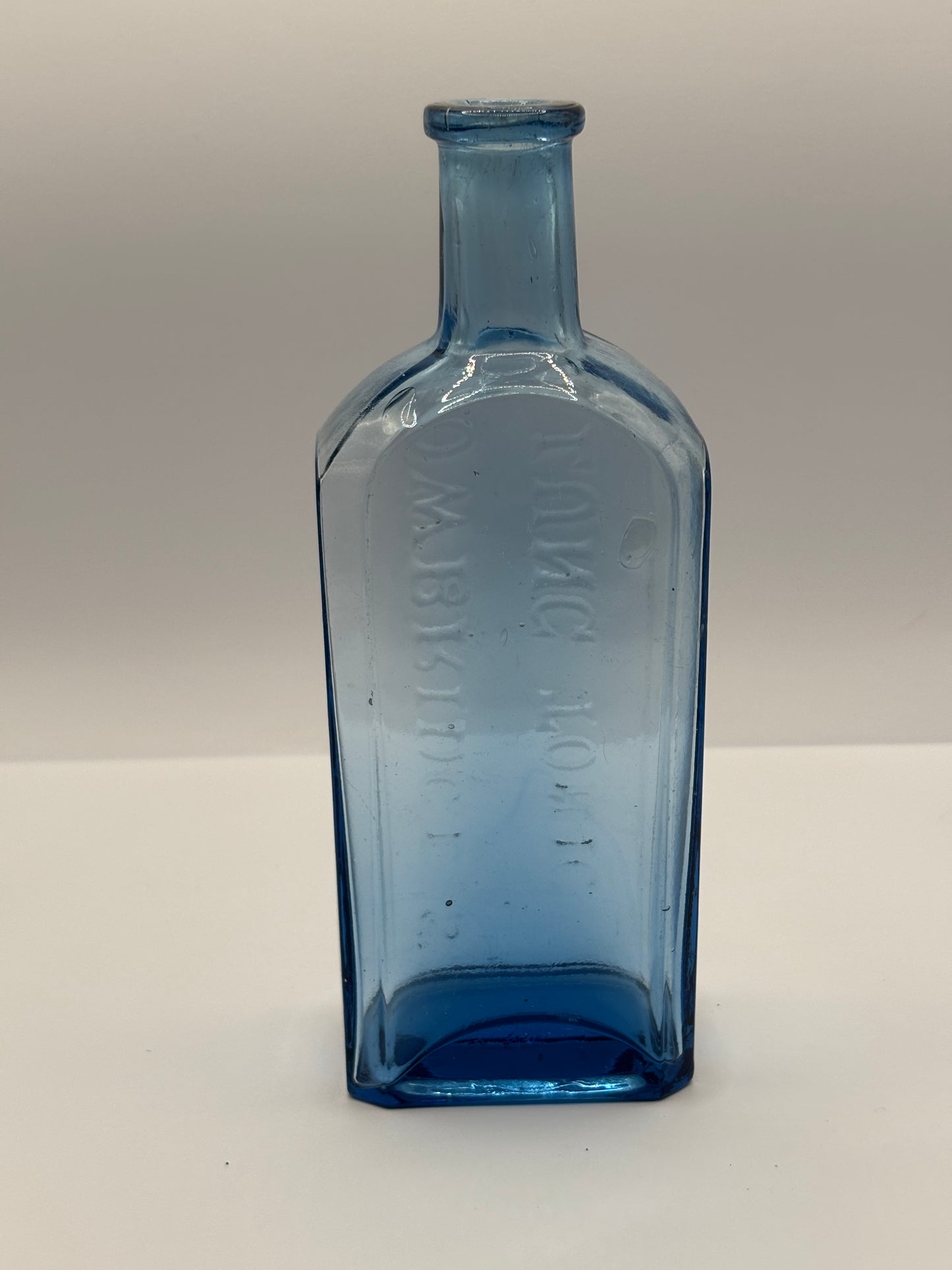 Old blue glass advertising chemist bottle, Owbridge Lung Tonic