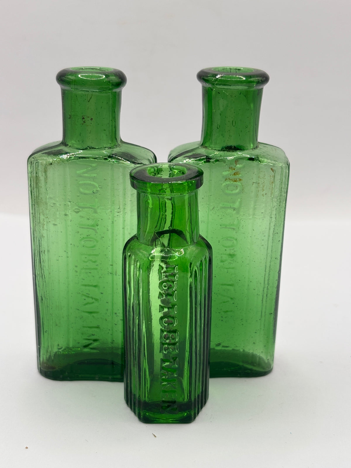 3 old small green ribbed poison bottles, not to be taken