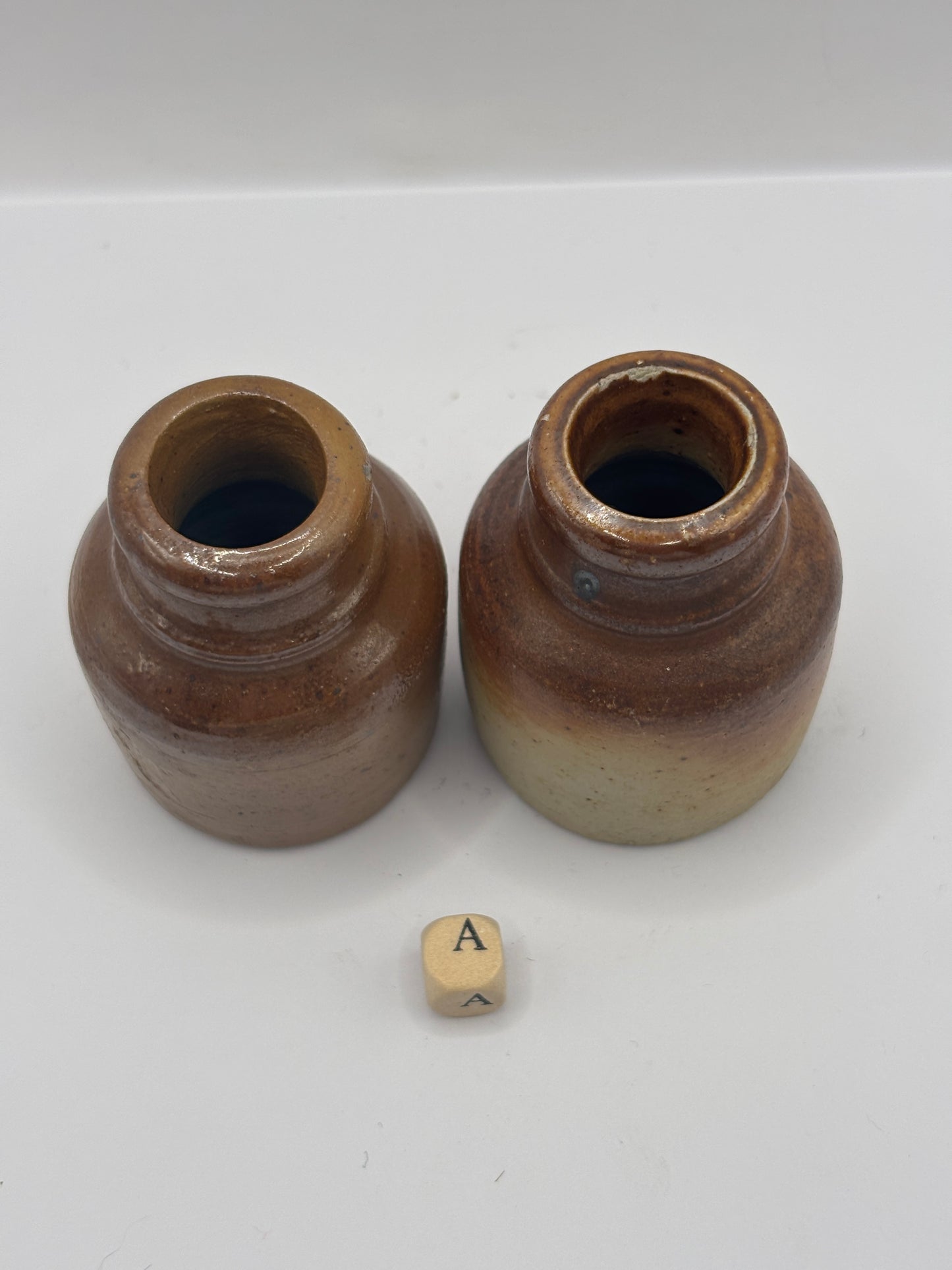 2 brown stoneware inkwells, ink bottles (a)