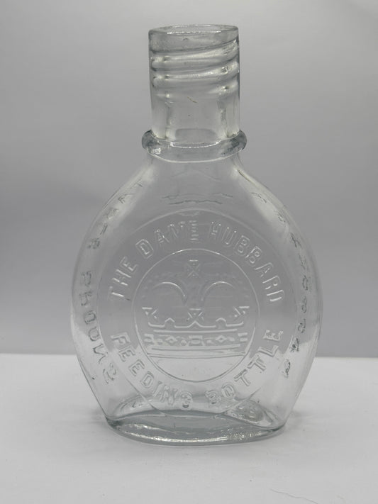 Old clear glass baby feeder. The Dame Hubbard feeding bottle