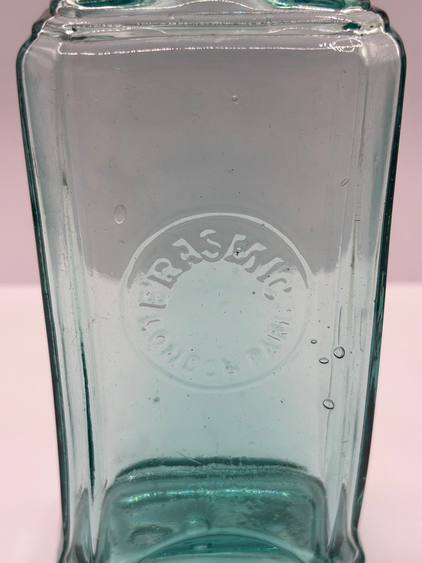 Old aqua glass advertising bottle. Perfume? Erasmic London Paris