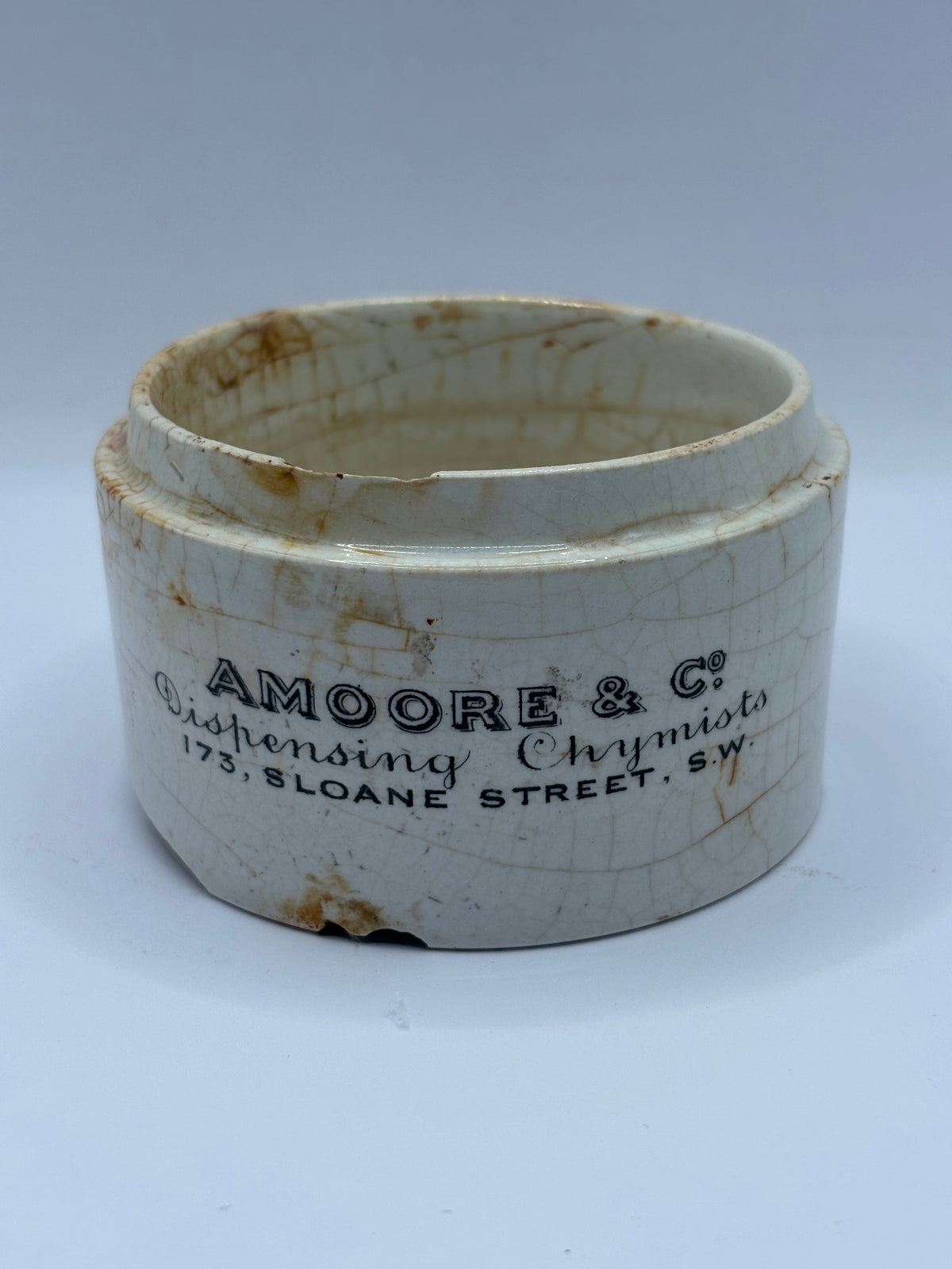 Old advertising base, amoore & Co dispensing chymists. Damaged