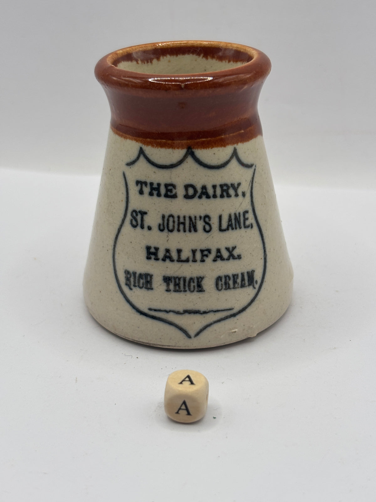 Old advertising cream pot, The dairy, Johns lane, Halifax (a)