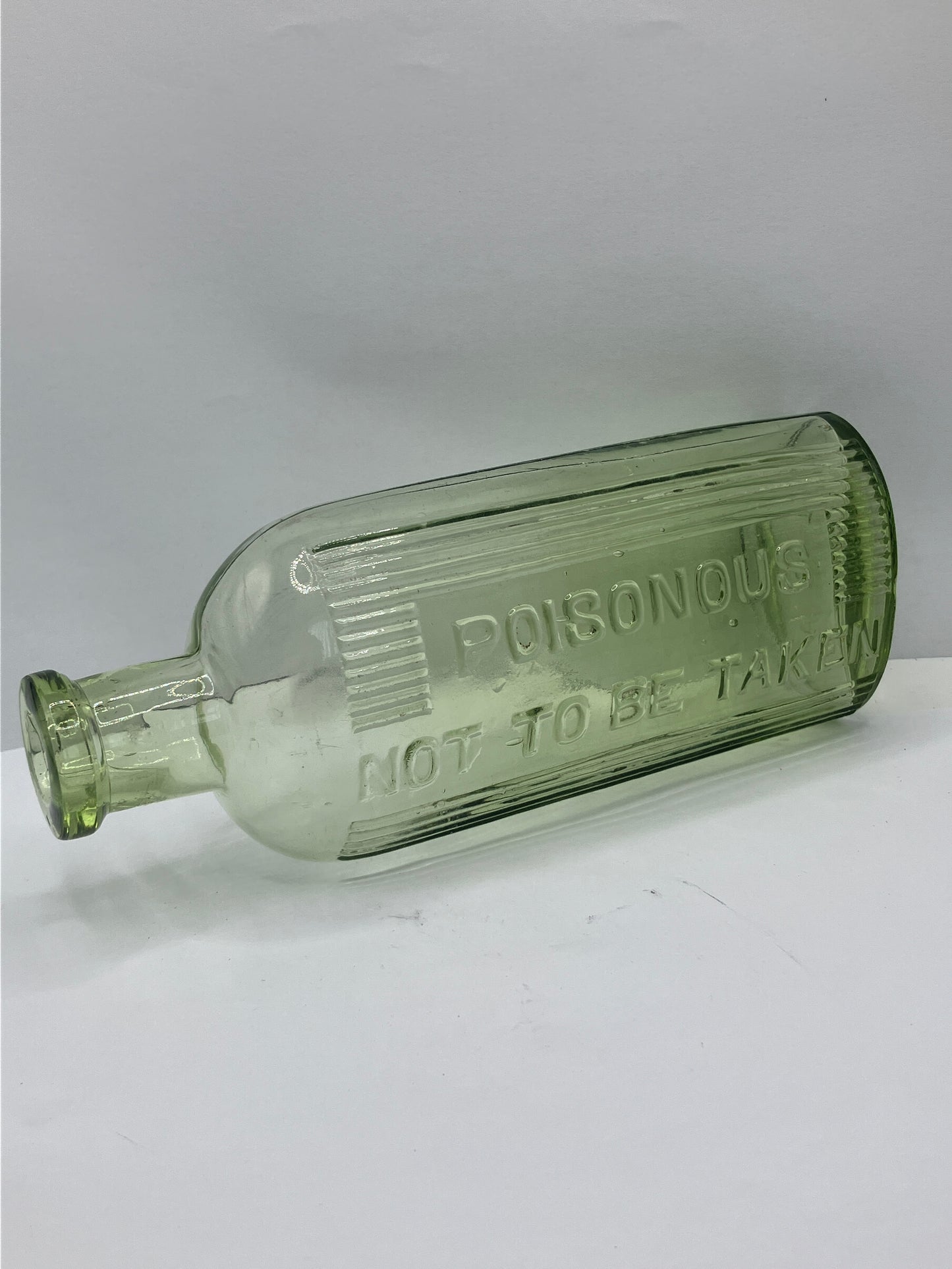 Green glass poison bottle, poisonous not to be taken