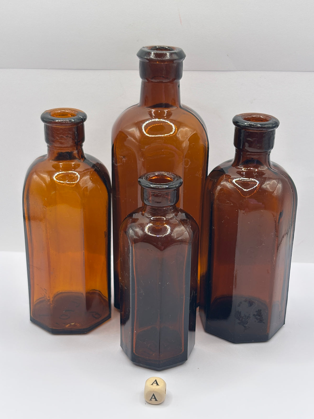 4 Old amber glass medicine bottles (A)