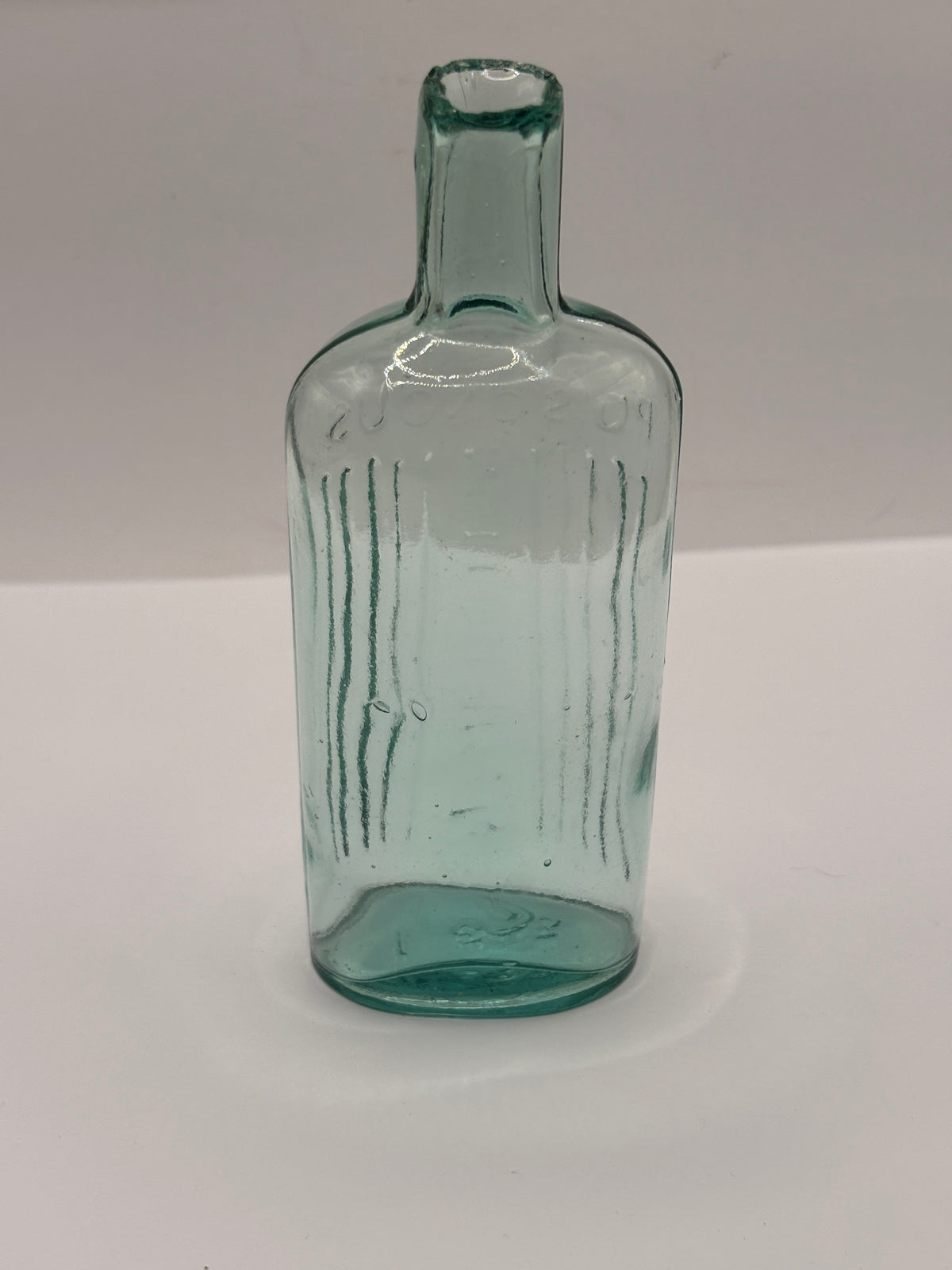 Old aqua glass poison bottle, POISONOUS Not to be taken