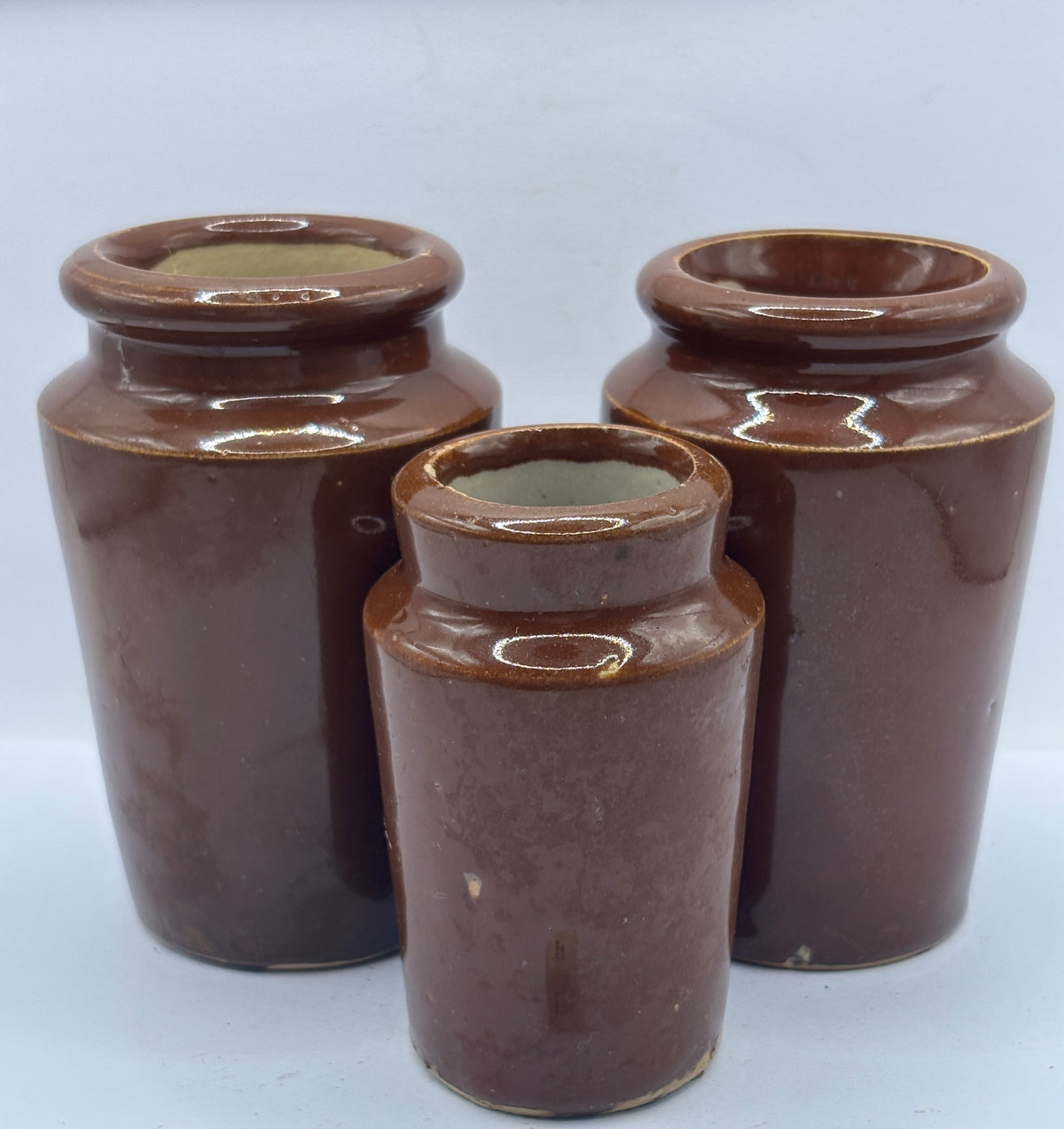 3 Old brown stoneware cream pots