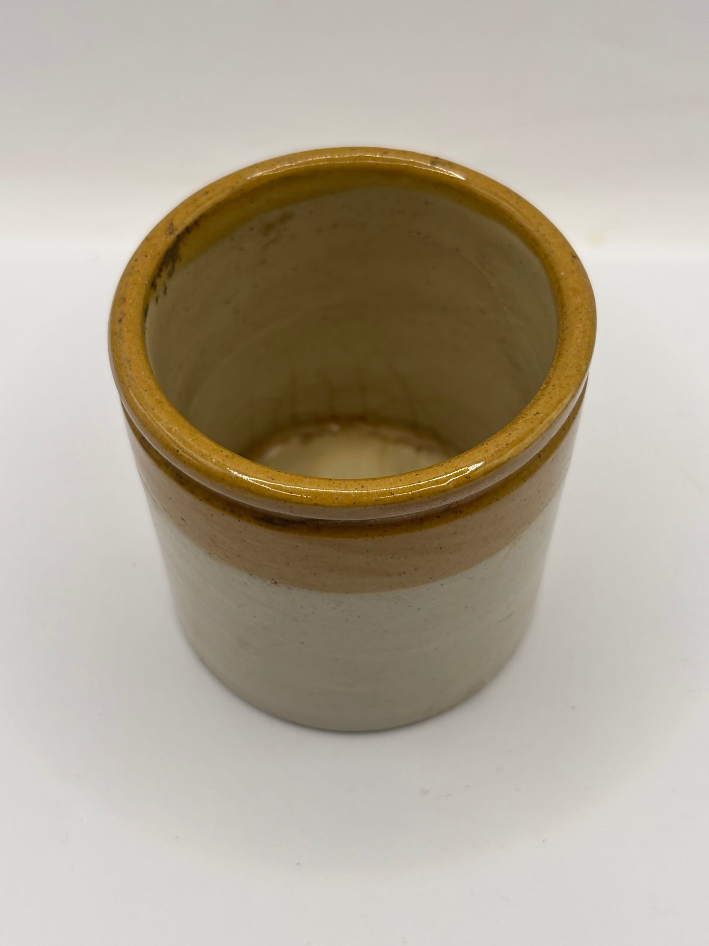 Old small brown top stoneware jar