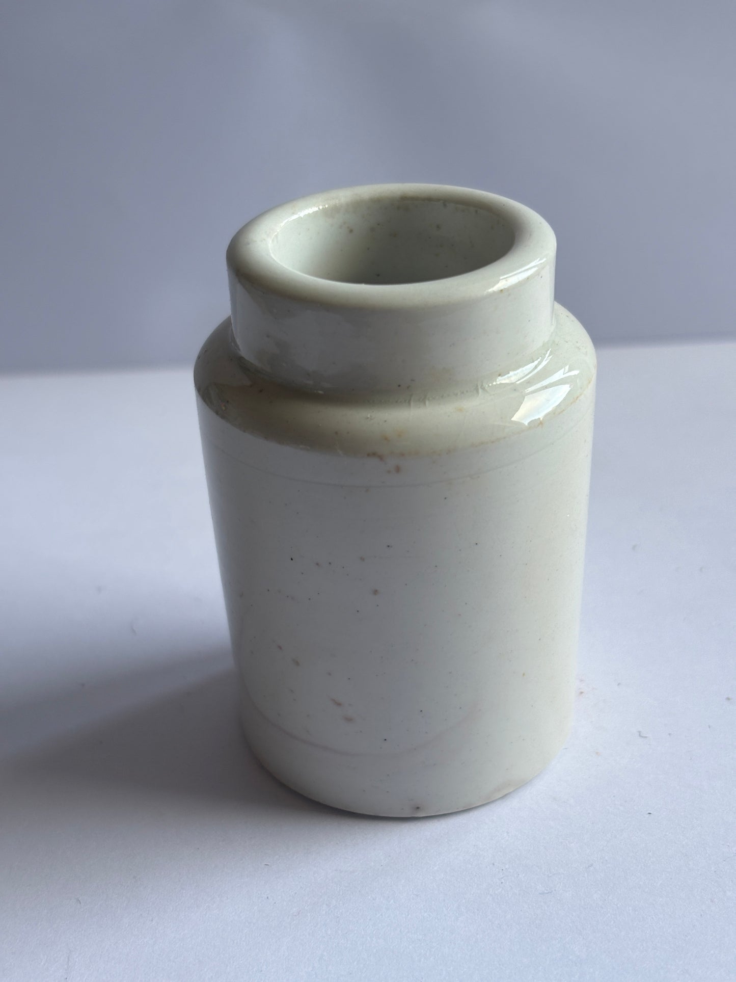 Old white stoneware pot