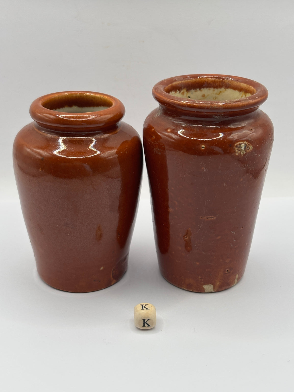 2 Old brown stoneware cream pots (K)