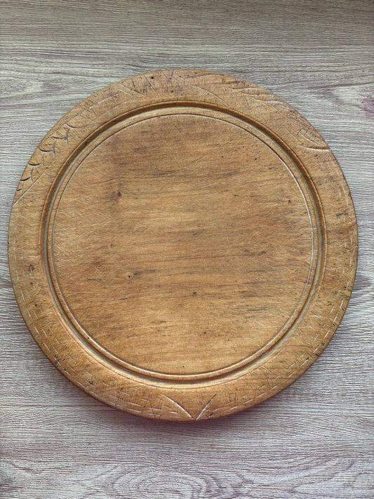 Old wooden carved bread board