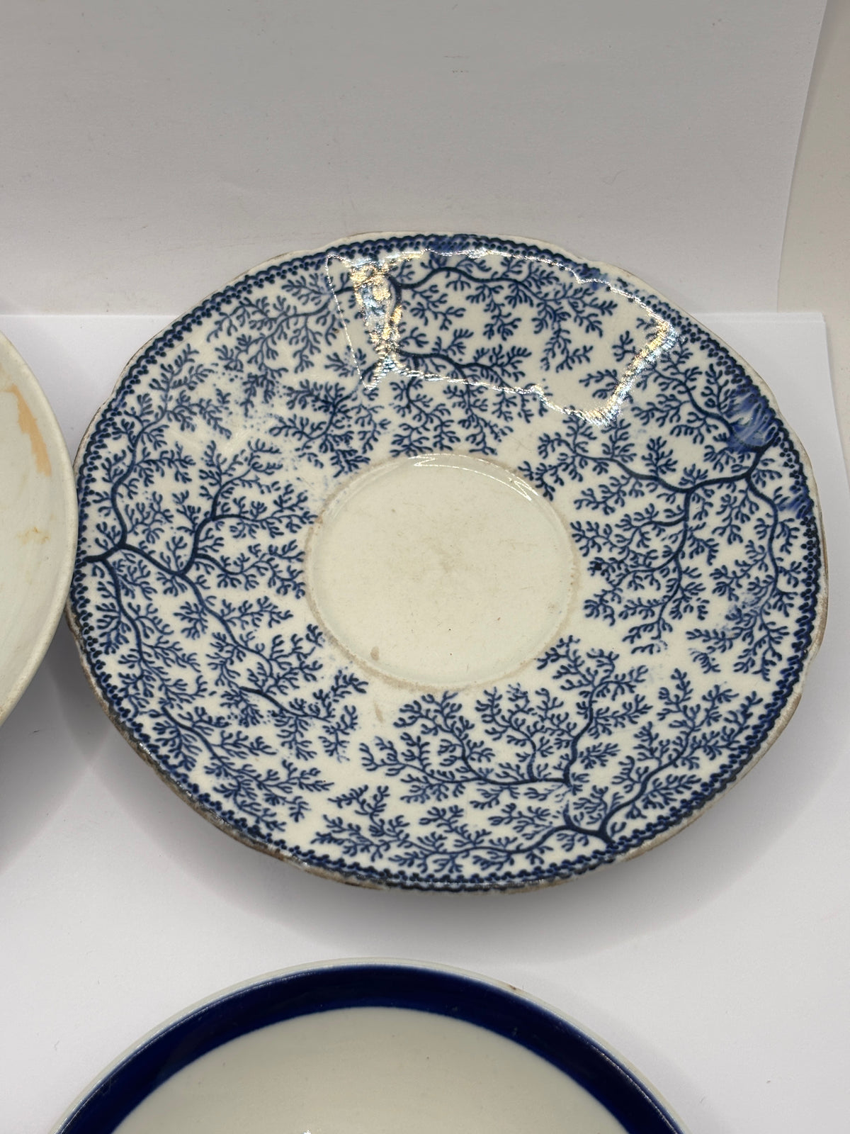 4 old decorative saucers (all dump dug)