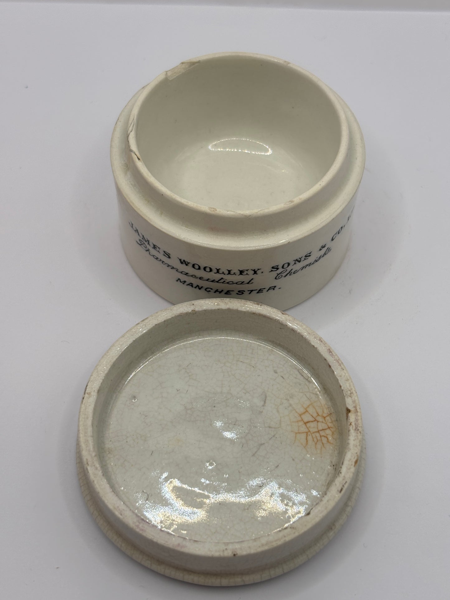 Old advertising chemist lid and base. James Woolley pharmaceutical chemist