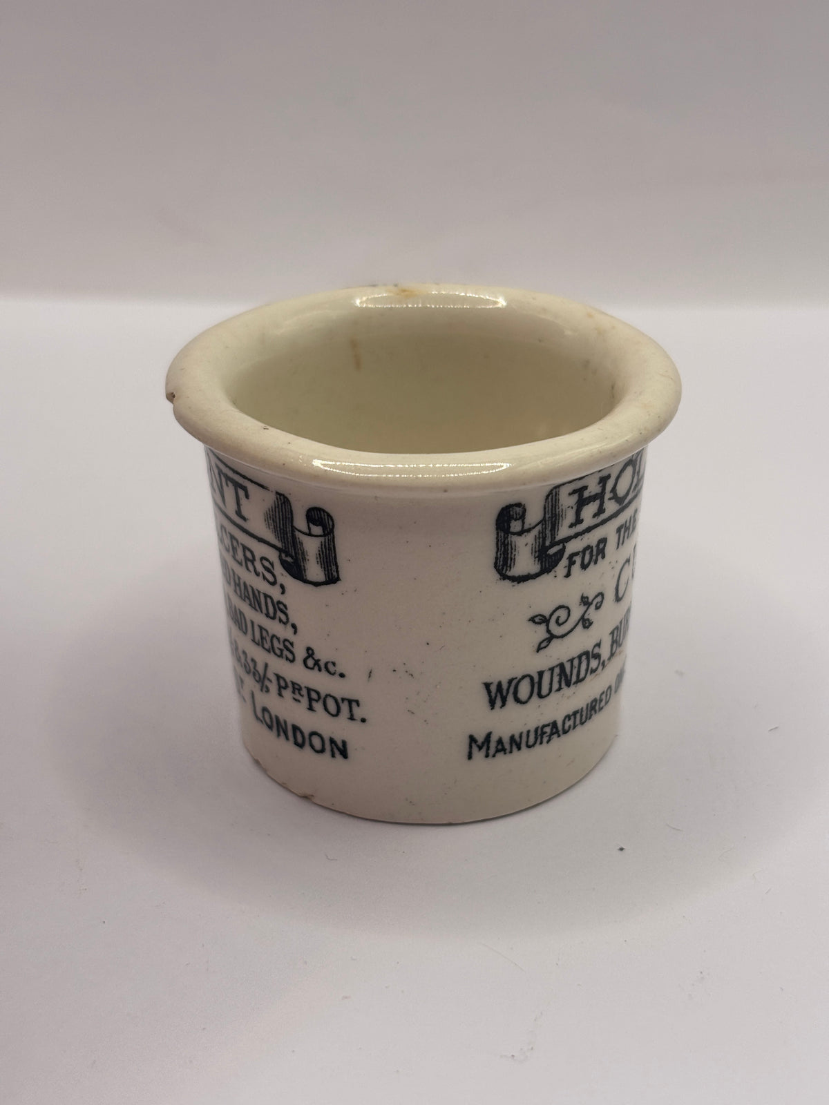 Old advertising ointment pot, Holloways ointment. Small chip