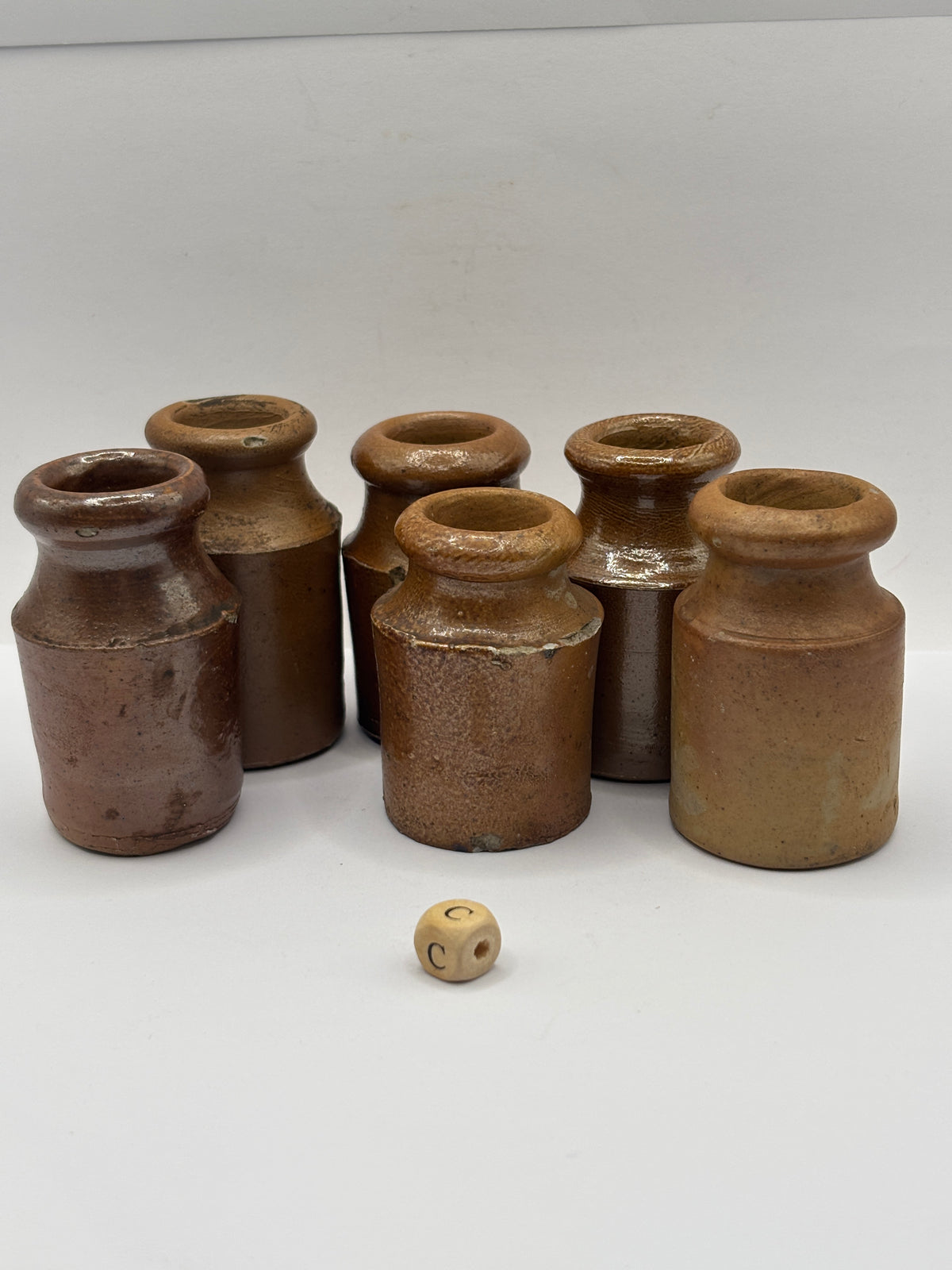 6 small brown stoneware pots (c)