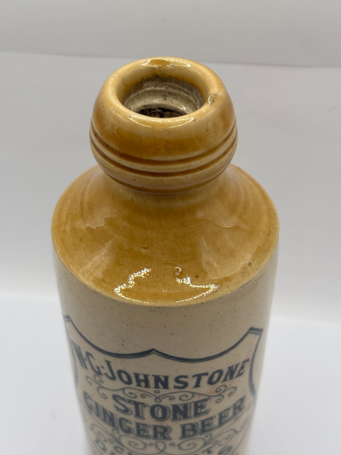 Old stoneware ginger beer bottle, W.G Johnstone chemists Dumfries