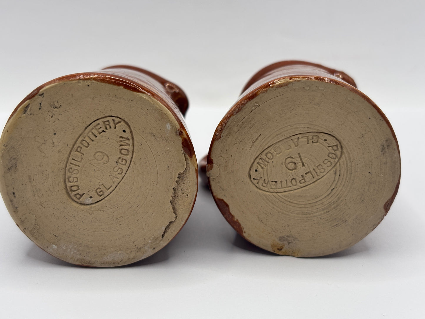 2 old small brown stoneware cream pots, pouring cream