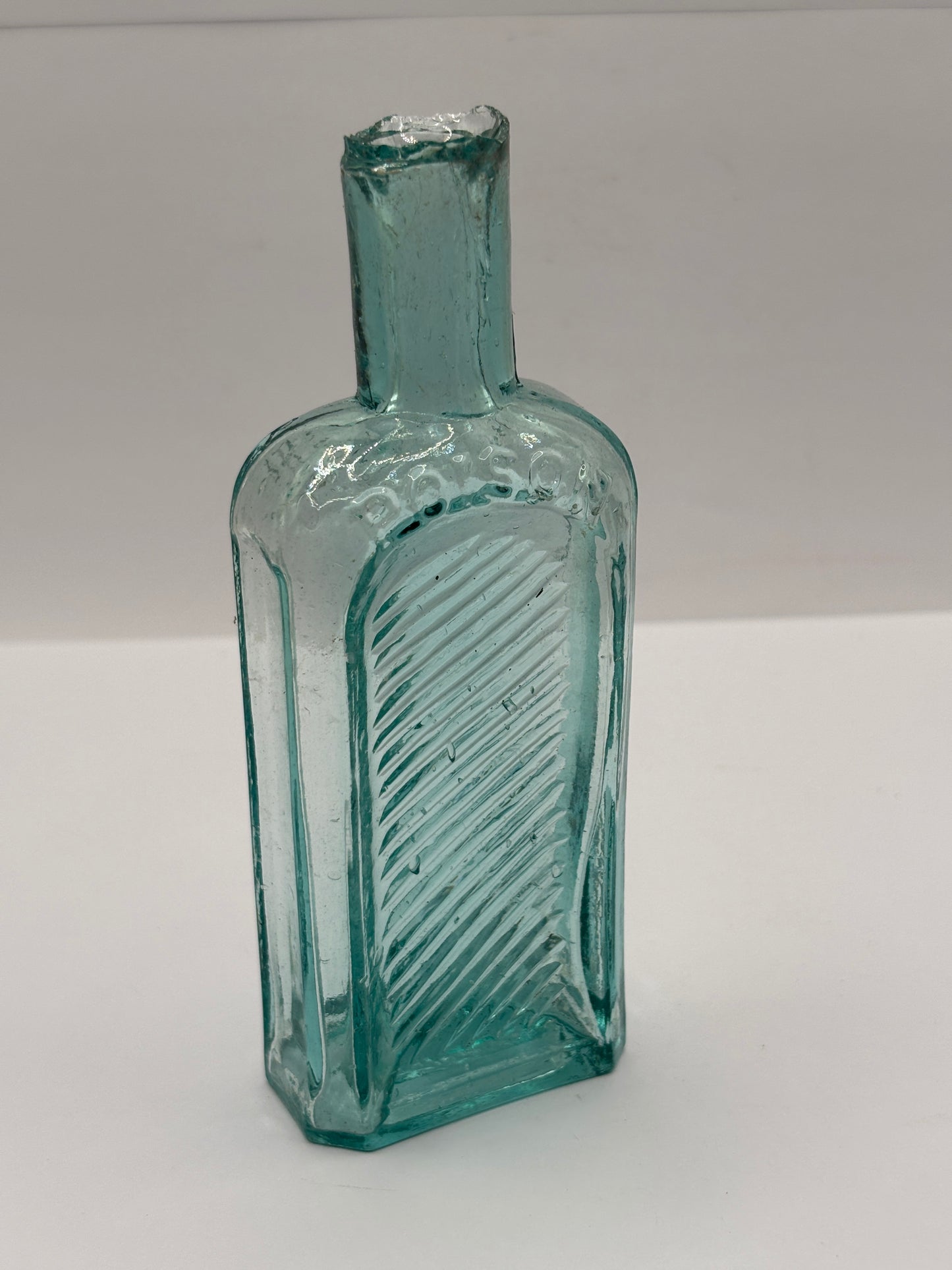 Old aqua glass poison bottle, not to be taken
