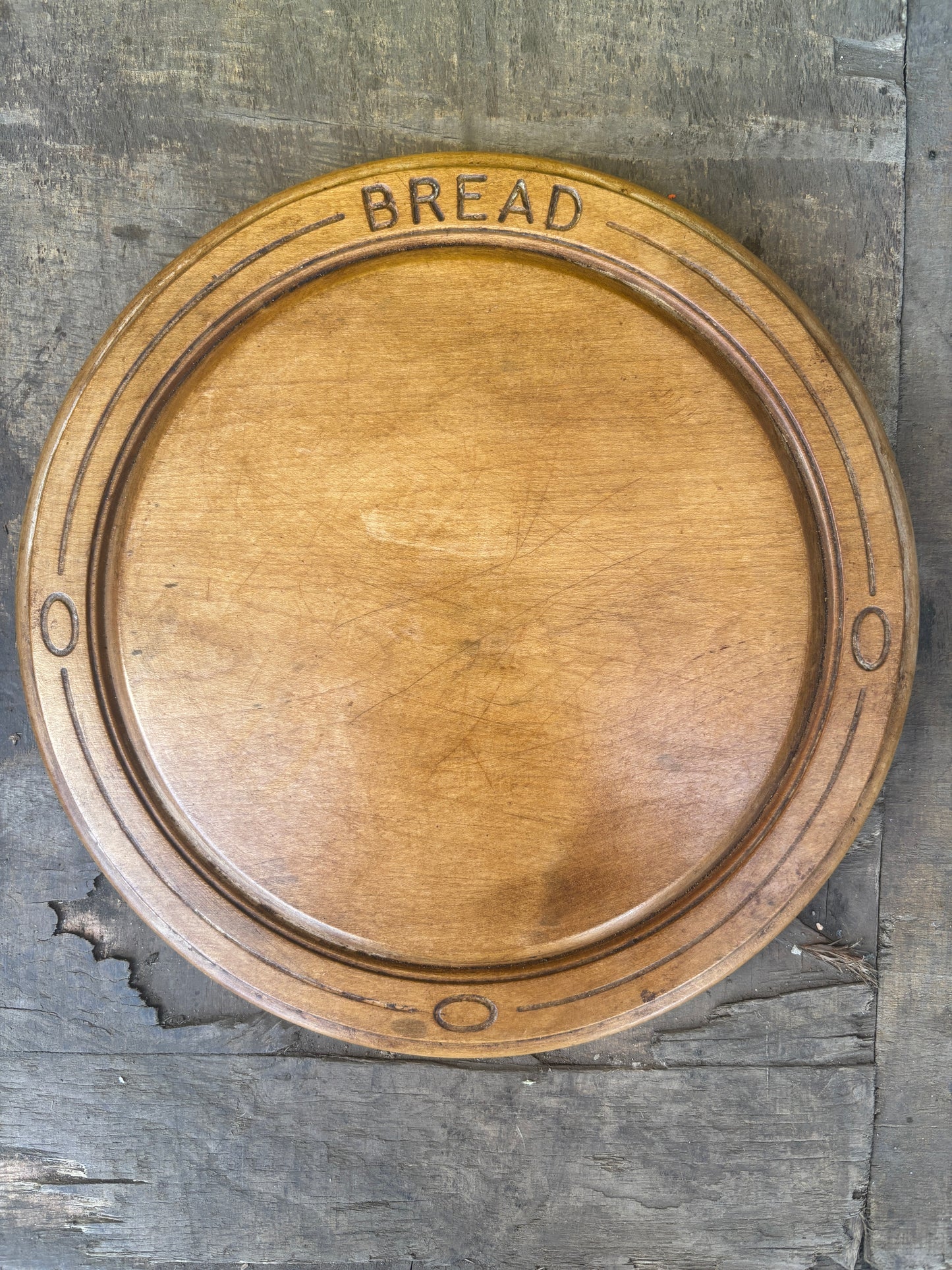 Old wooden carved bread board