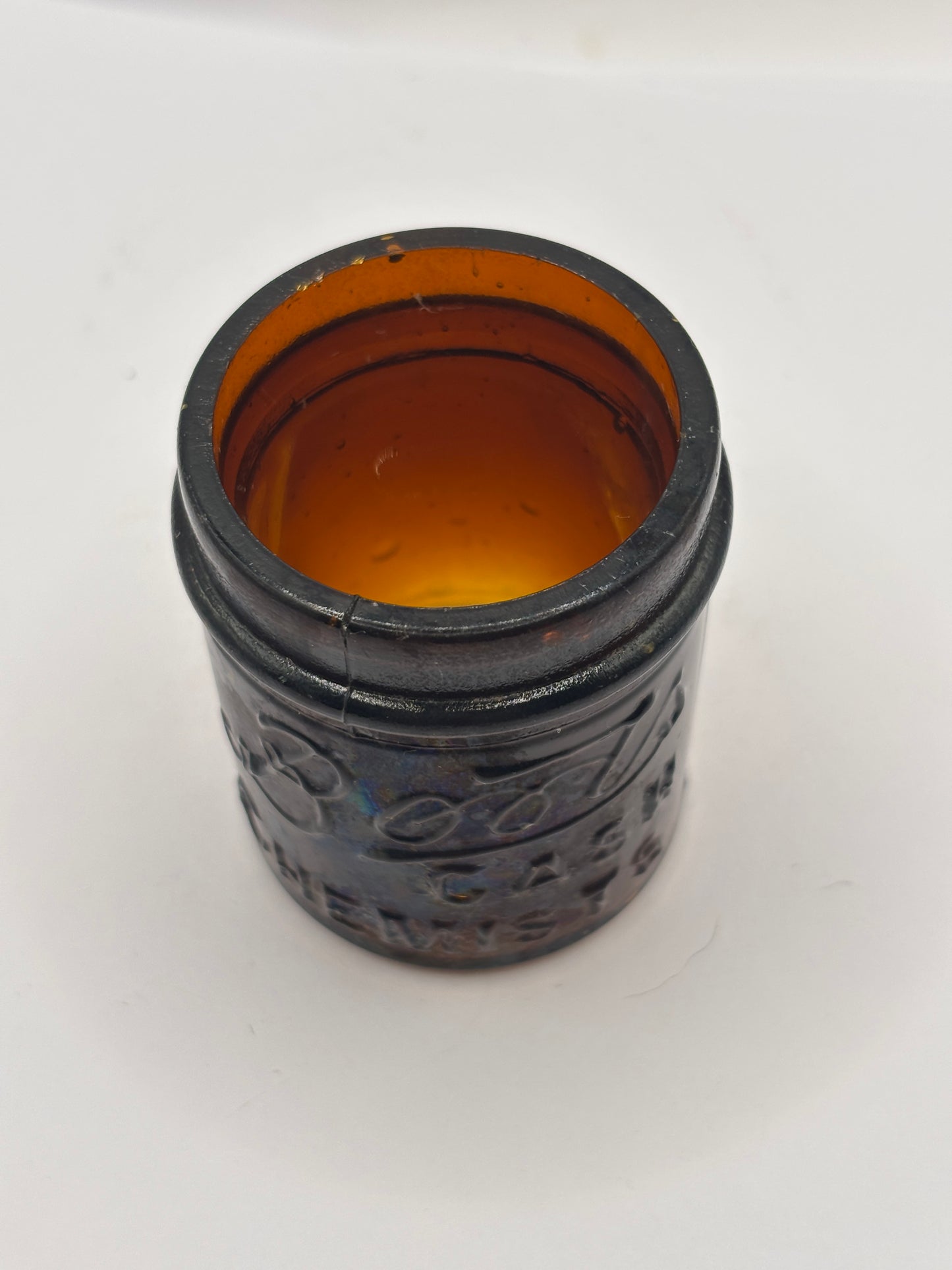 Small old amber glass boots jar