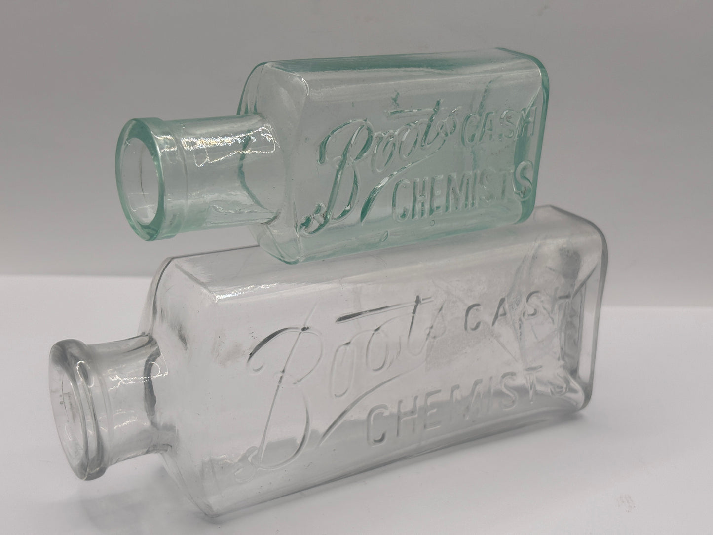 2 Old glass Boots cash chemists bottles
