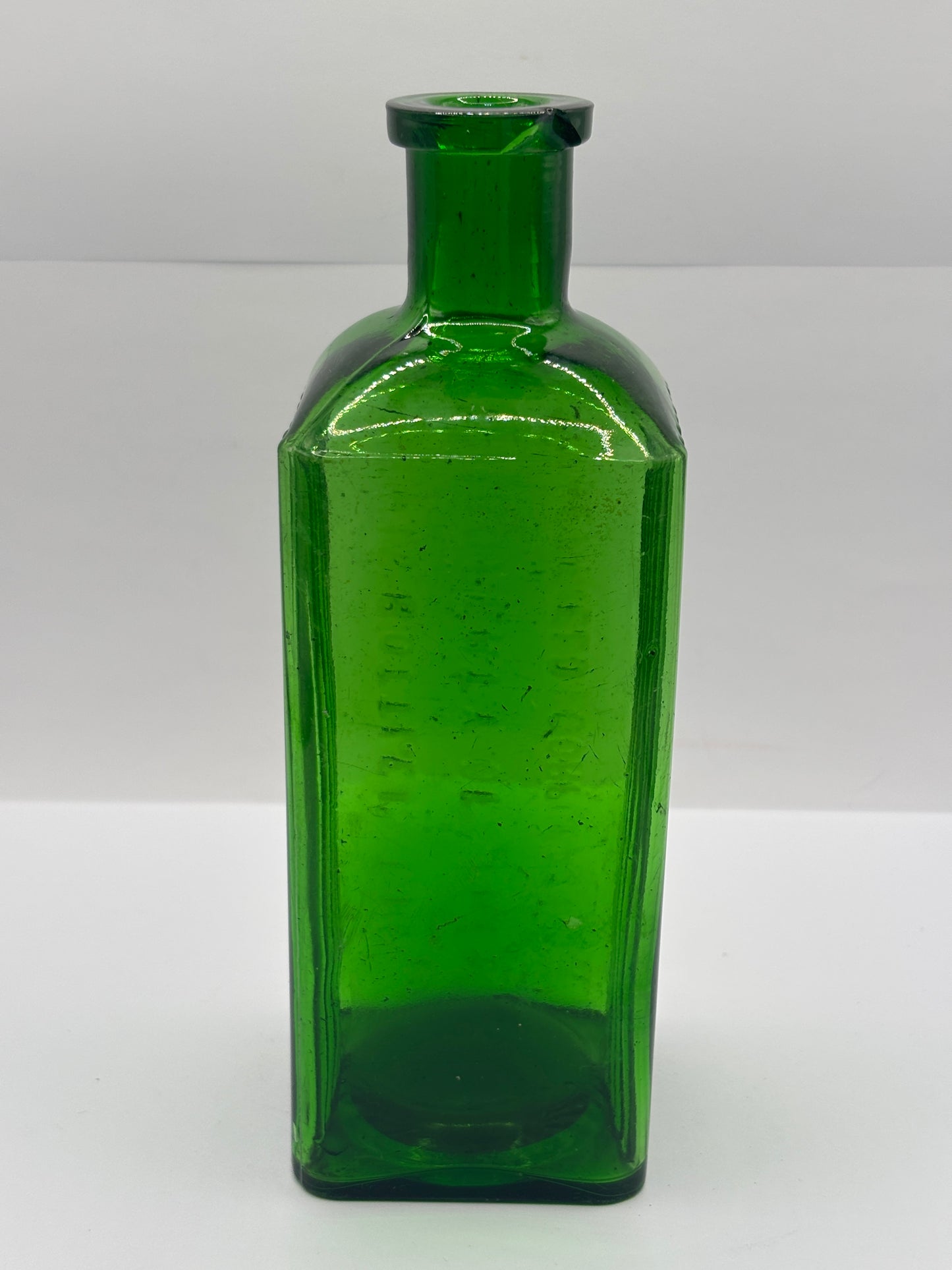 Old green glass poison bottle, Sheffield corporation poison bottle. Chipped